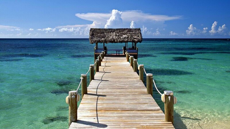Wooden pier with thatched hut