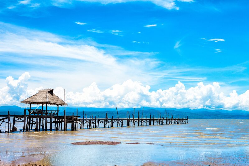 Wooden pier with thatched hut