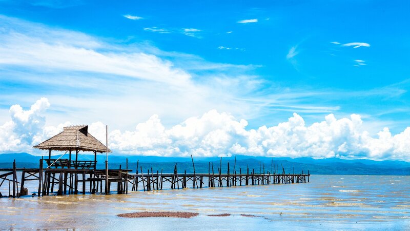 Wooden pier with thatched hut