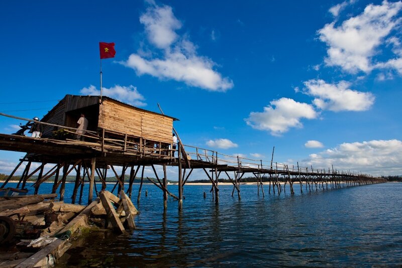 Wooden pier with Vietnamese flag