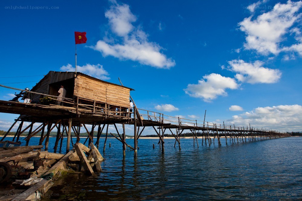 Wooden pier with Vietnamese flag