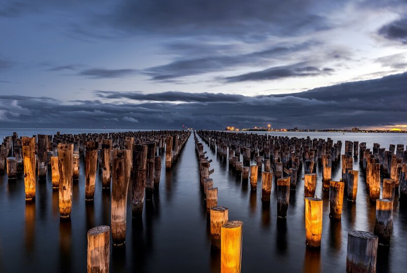 Wooden Pilings in Water — Blue, Dramatic