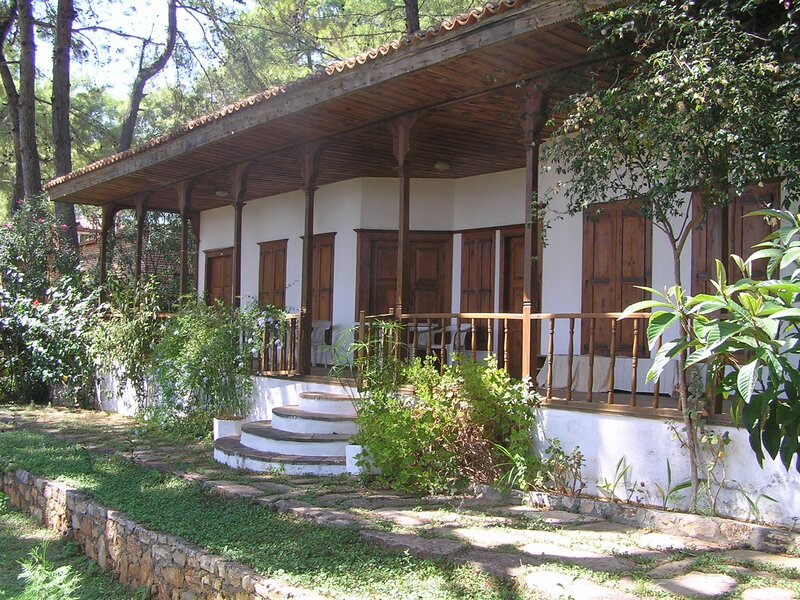 Wooden porch cottage in forest