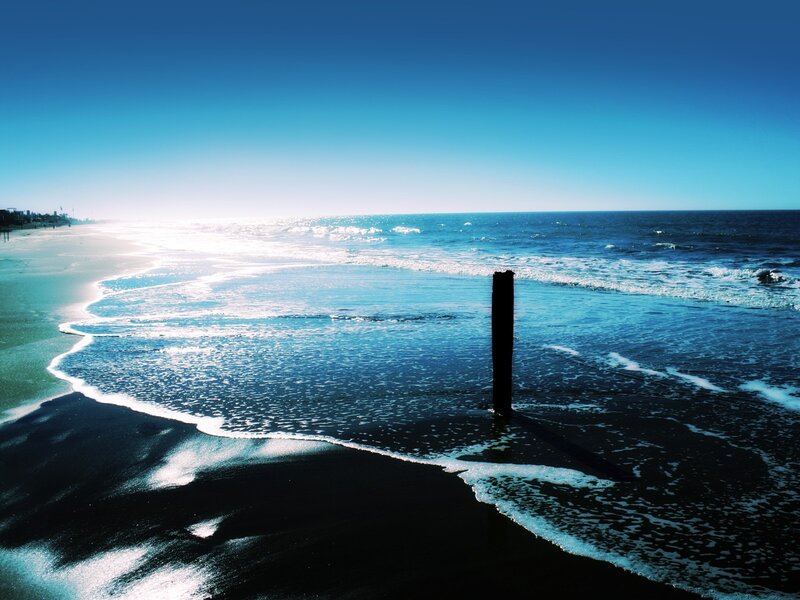 Wooden Post in Ocean