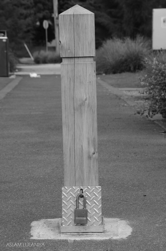 wooden post with padlock