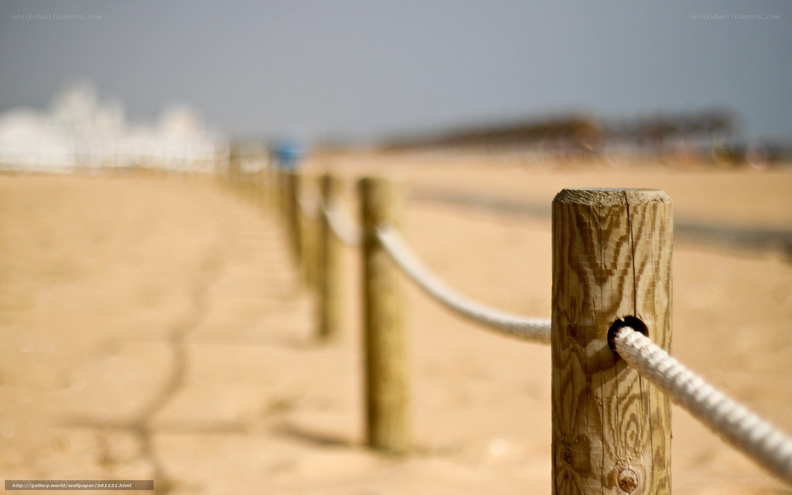 Wooden posts and rope on a beach
