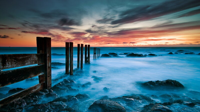 Wooden Posts in Ocean — Blue, Dramatic