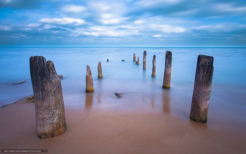 Wooden Posts in Ocean — Blue, Serene, Morning