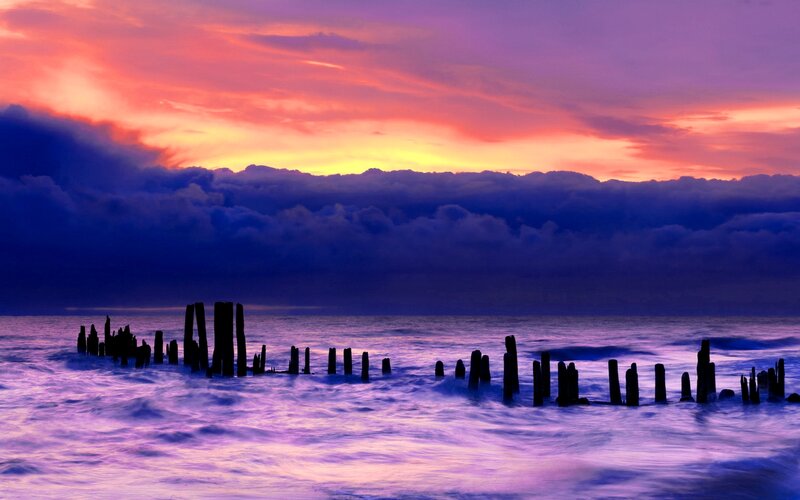 Wooden Posts in Ocean — Purple, Dramatic