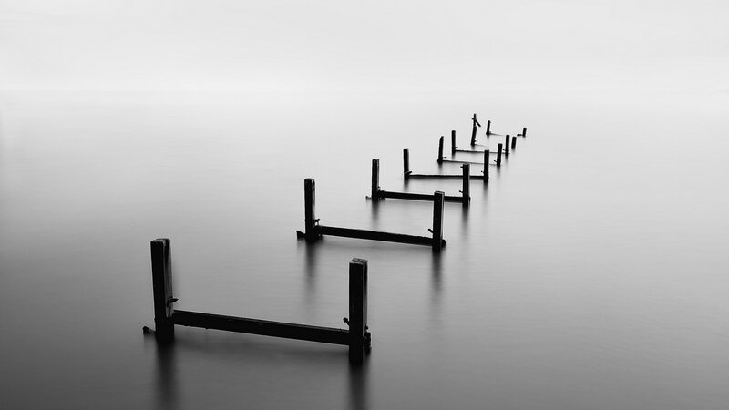Wooden Posts in Water — Black