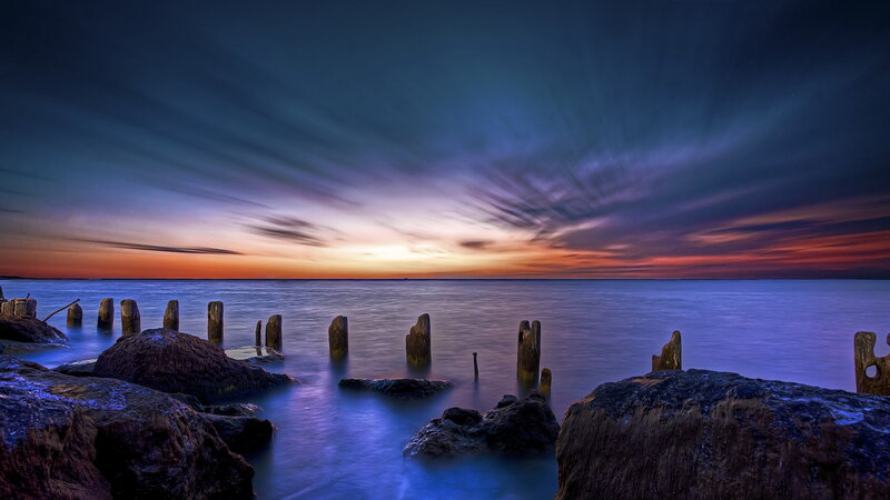 Wooden Posts in Water — Blue, Dramatic, Sunset, Photograph