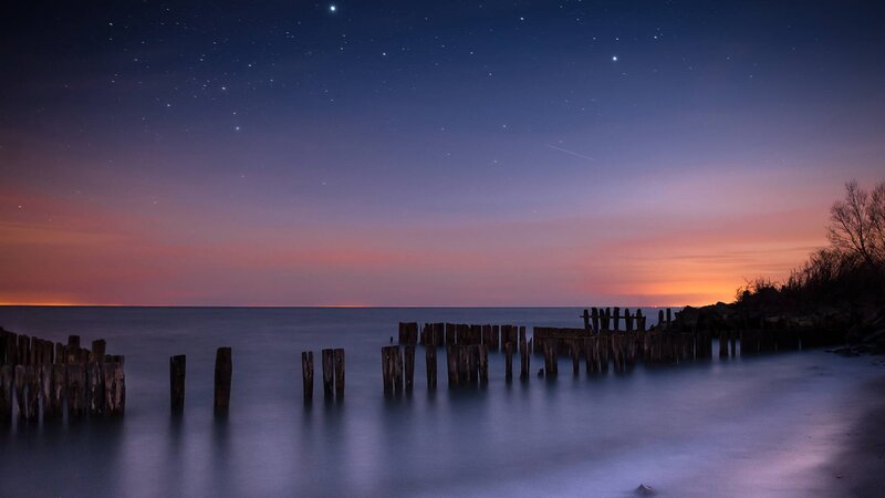 Wooden Posts in Water — Blue, Serene, Night, Photograph, Stars