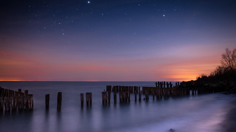 Wooden Posts in Water — Blue, Serene, Night