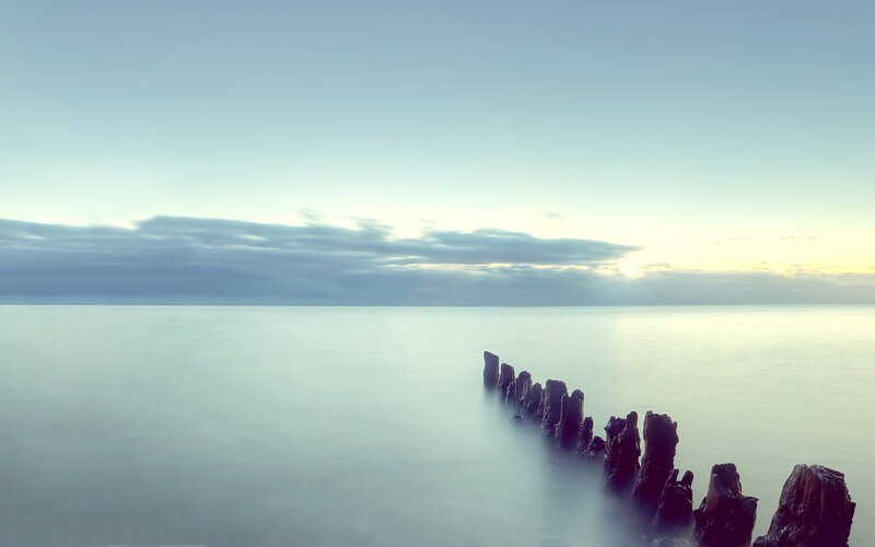 Wooden Posts in Water — Blue, Serene, Sunrise