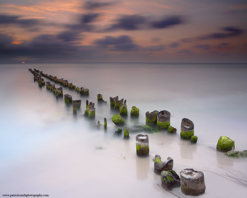 Wooden Posts in Water — Blue, Serene, Sunset, Photograph, Ocean