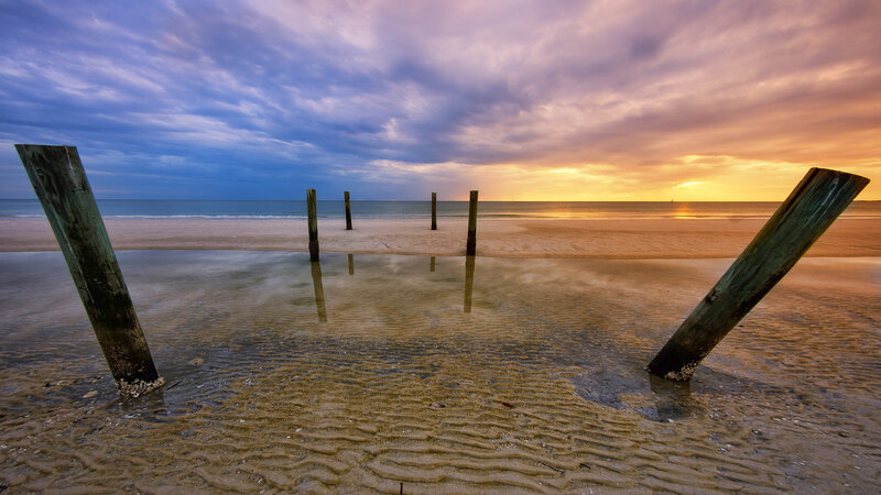 Wooden Posts on Beach — Blue, Serene