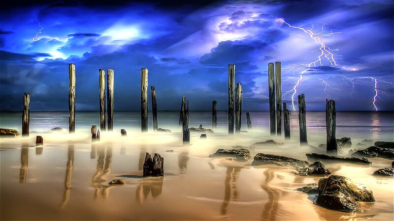 Wooden Posts on Beach — Blue