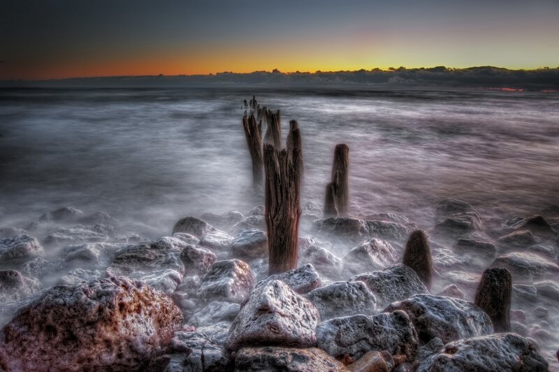 Wooden Posts on Beach — Gray, Dramatic, Sunset