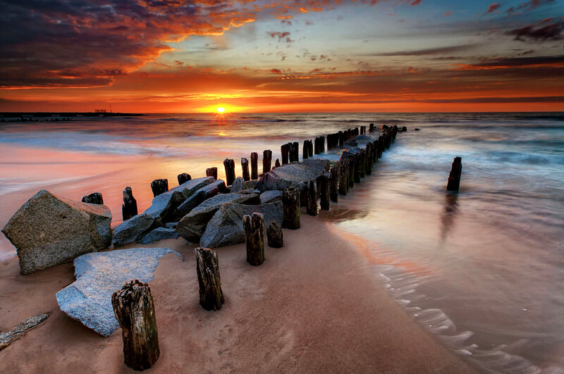 Wooden Posts on Beach — Orange, Dramatic, Sunset
