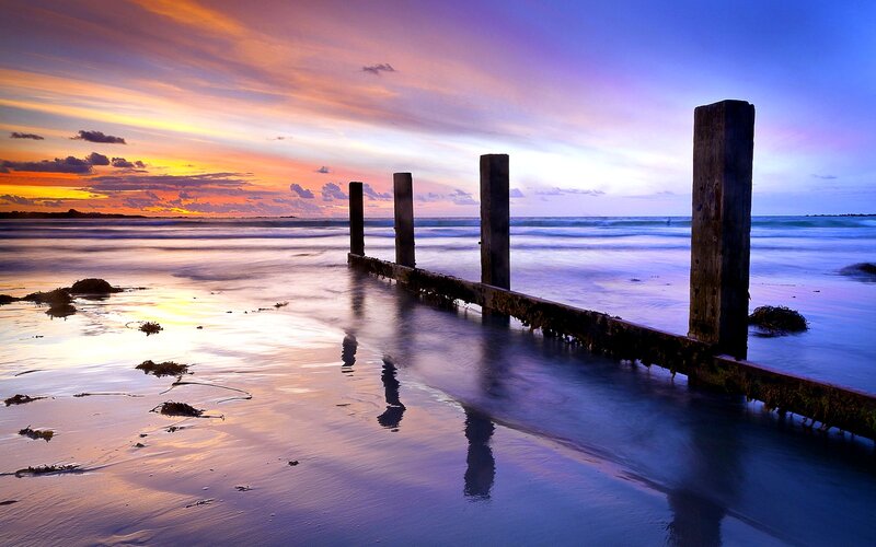Wooden Posts on Beach — Purple, Serene