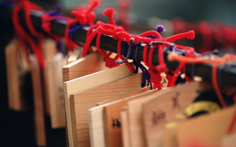 Wooden prayer plaques with ropes