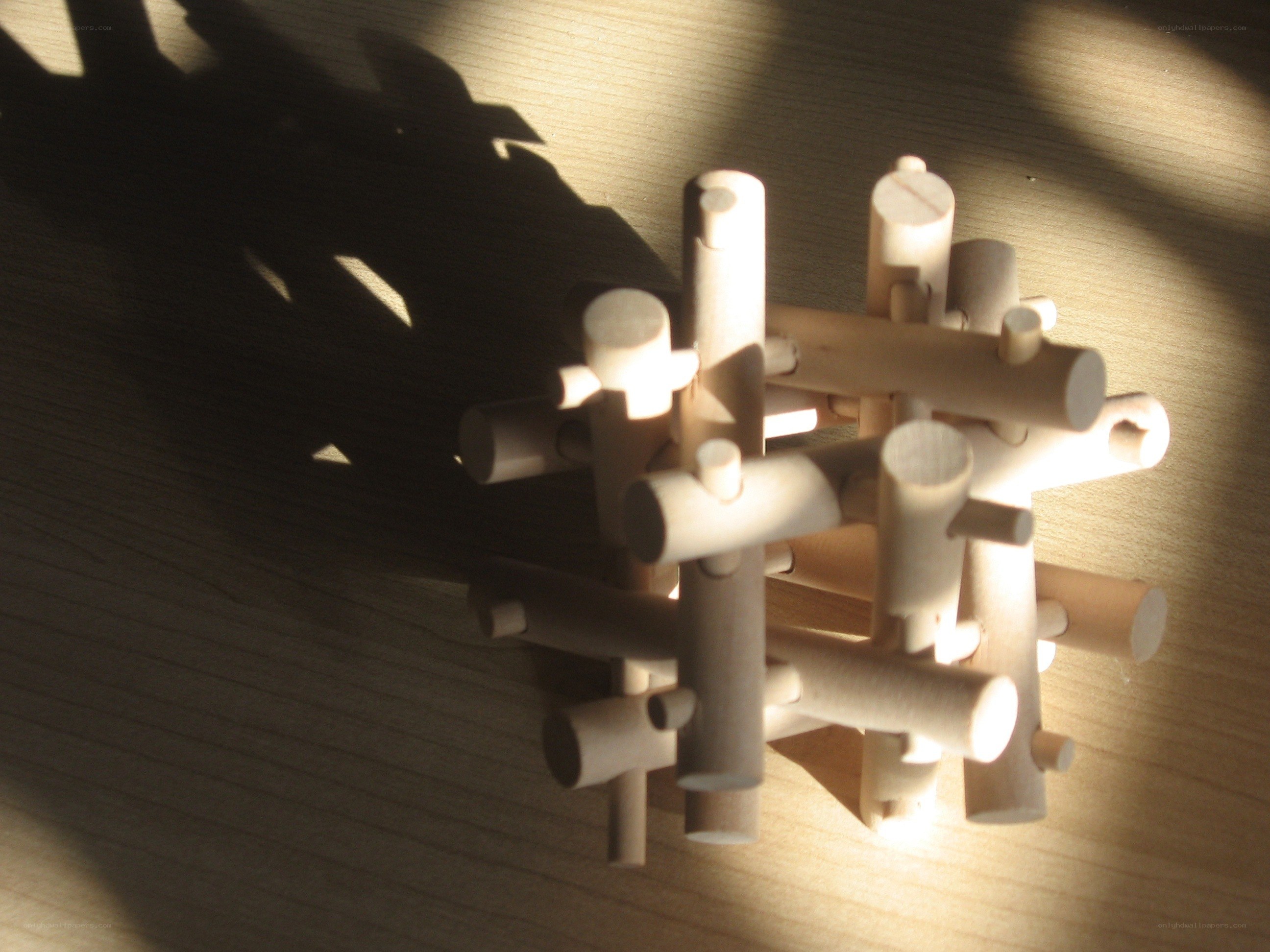 wooden puzzle in sunlight