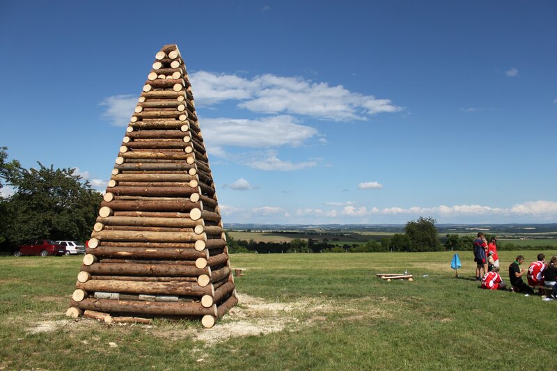 Wooden pyramid in a field