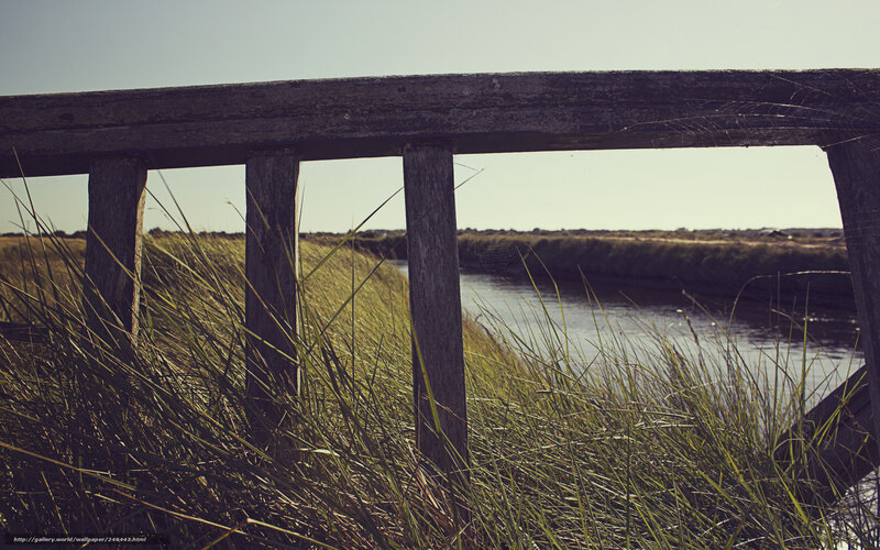 Wooden railing by a river