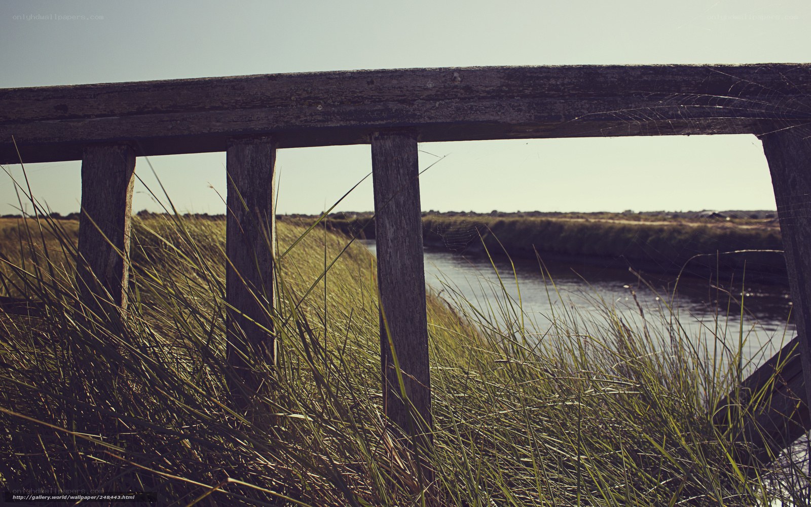 Wooden railing by a river