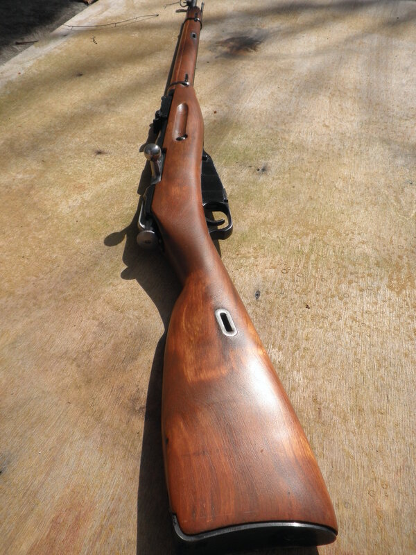 wooden rifle on concrete