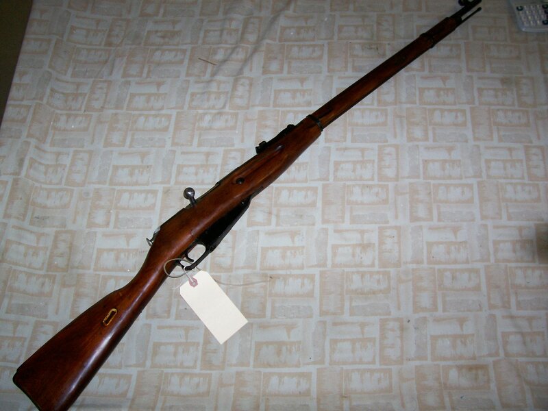 wooden rifle on patterned surface