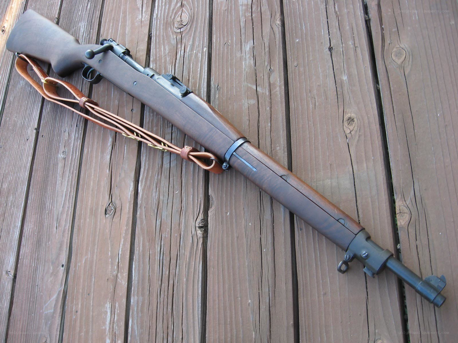 Wooden rifle with leather strap
