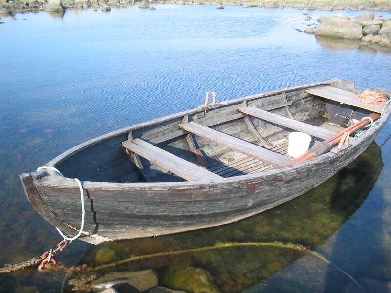 Wooden Rowboat in Water