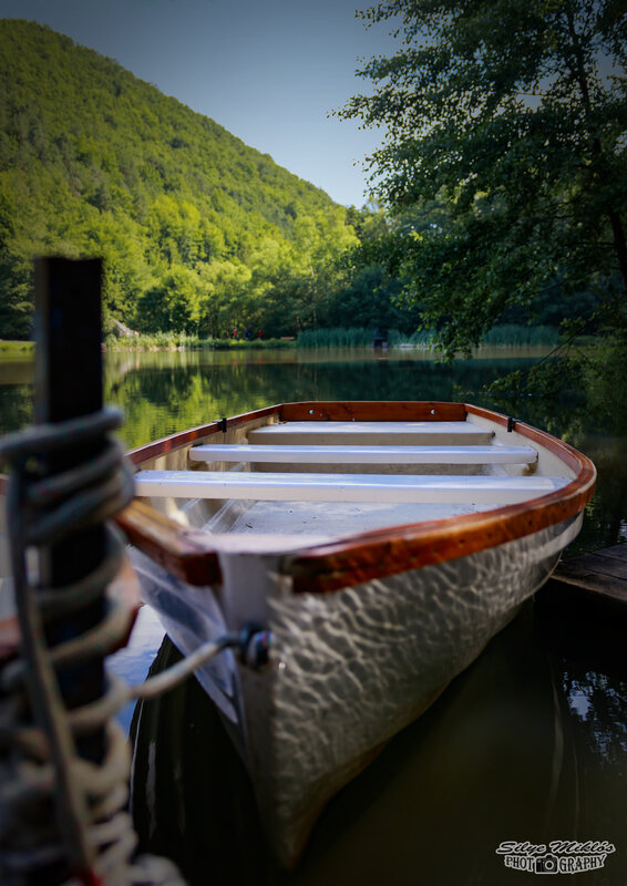 Wooden Rowboat on Lake