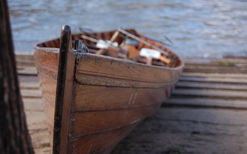 Wooden Rowboat on Shore