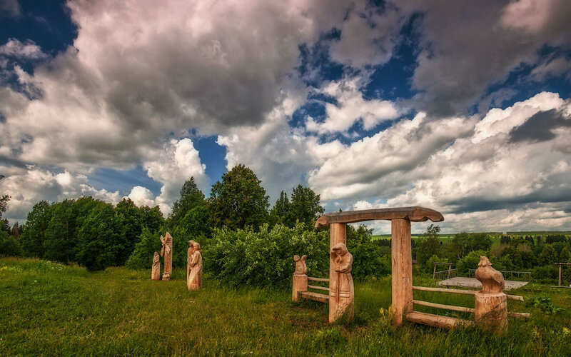 Wooden Sculptures in Field