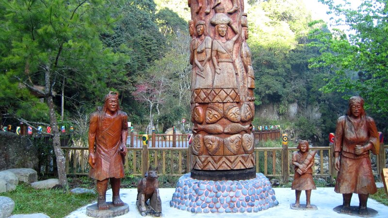 Wooden Sculptures in Forest