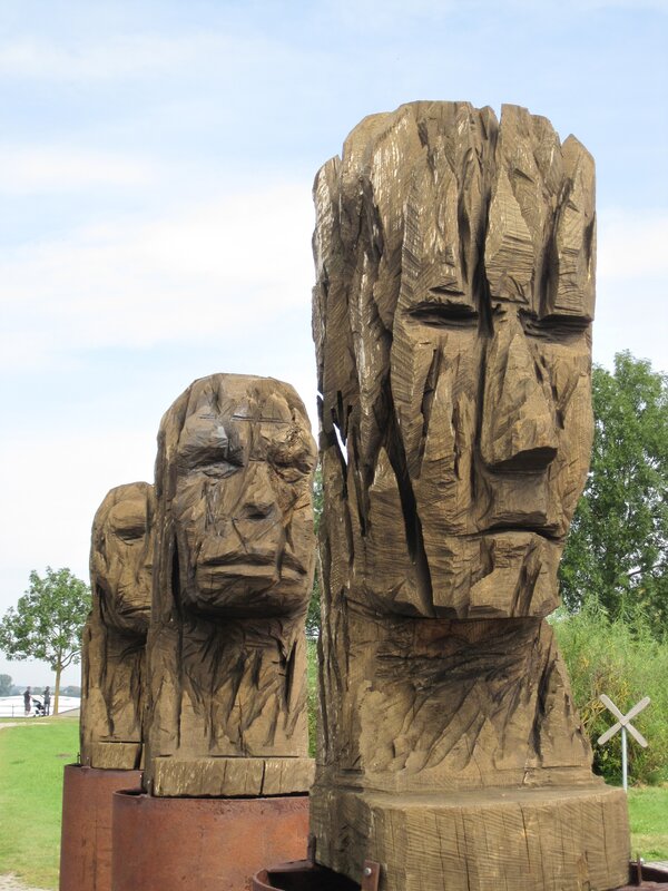 wooden sculptures of faces