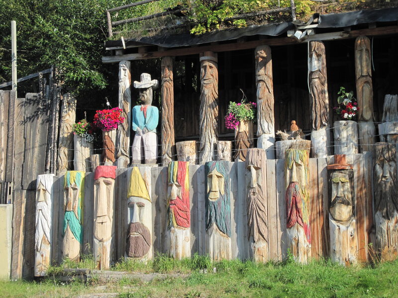 Wooden Sculptures on Fence