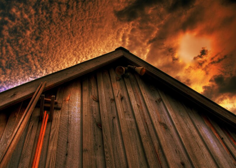 Wooden shed under stormy sky
