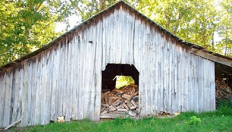 Wooden Shed with Firewood