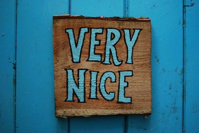 Wooden Sign on Blue Wall
