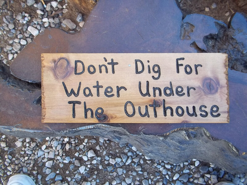 Wooden Sign on Ground