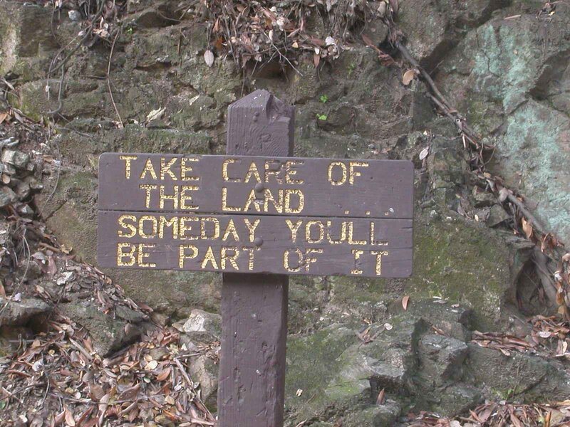 Wooden sign with land care message