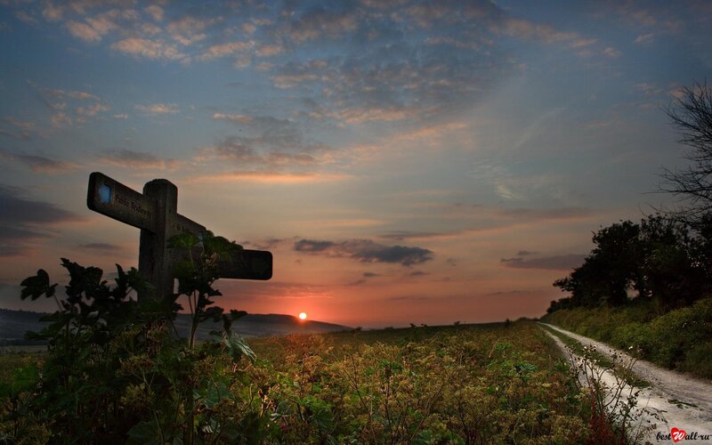 Wooden Signpost at Sunset
