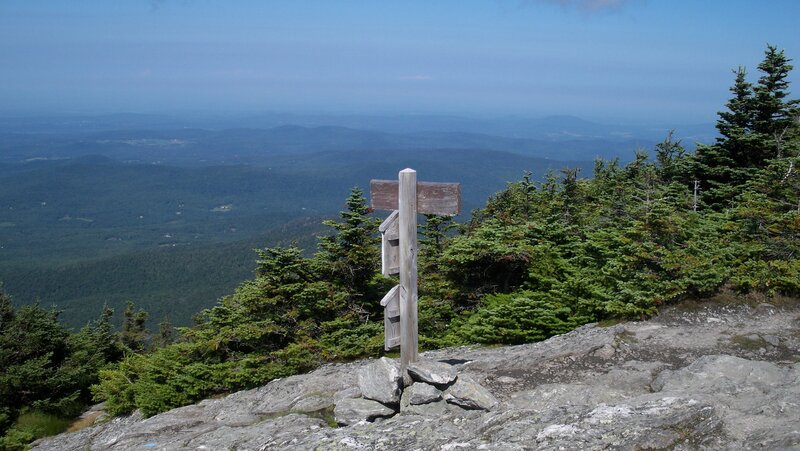 Wooden Signpost on Mountain