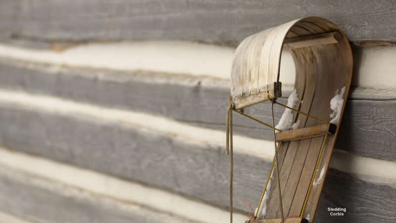 Wooden Sled Against Wall