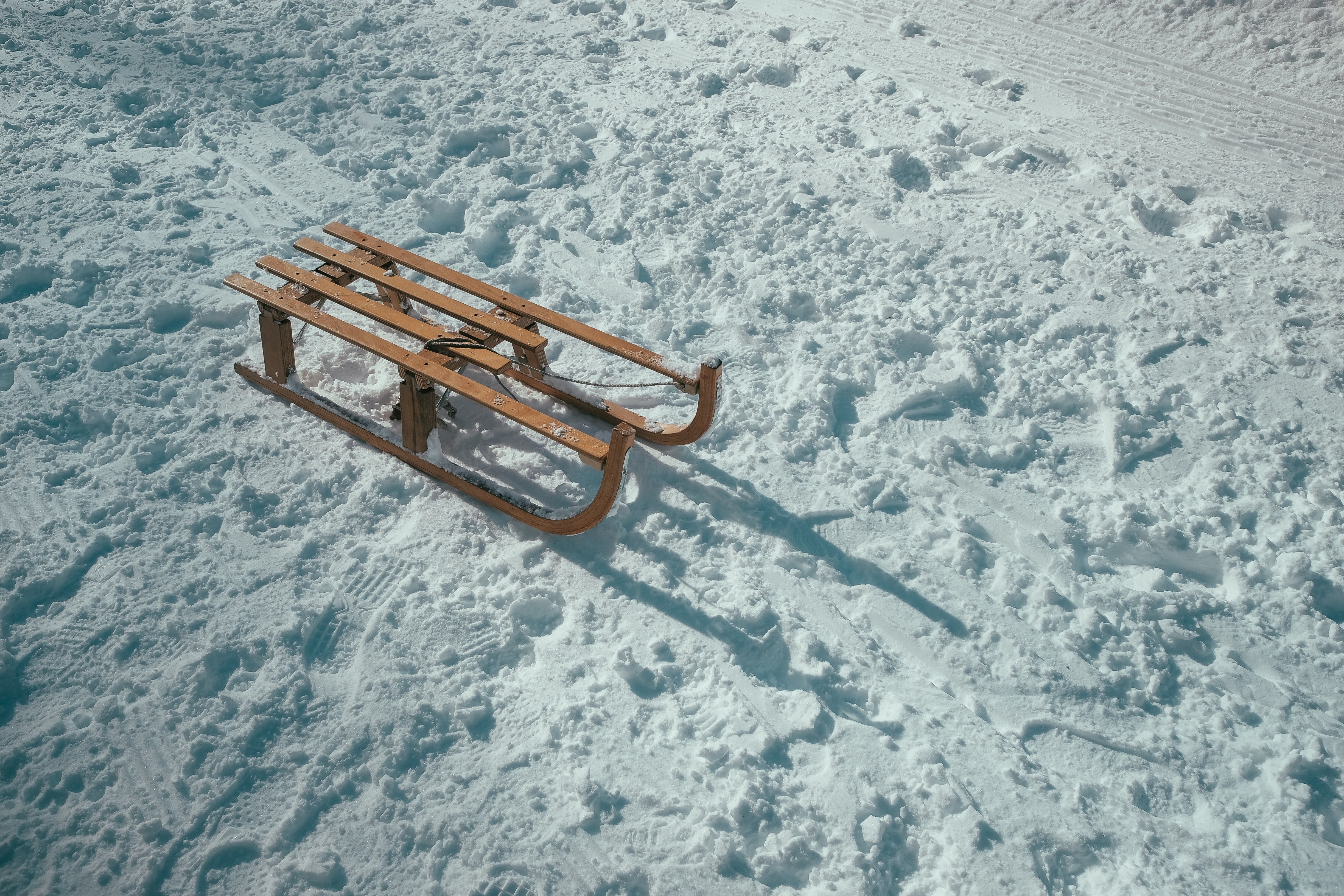 Wooden sled on snowy ground