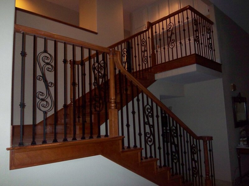Wooden Staircase with Iron Railings