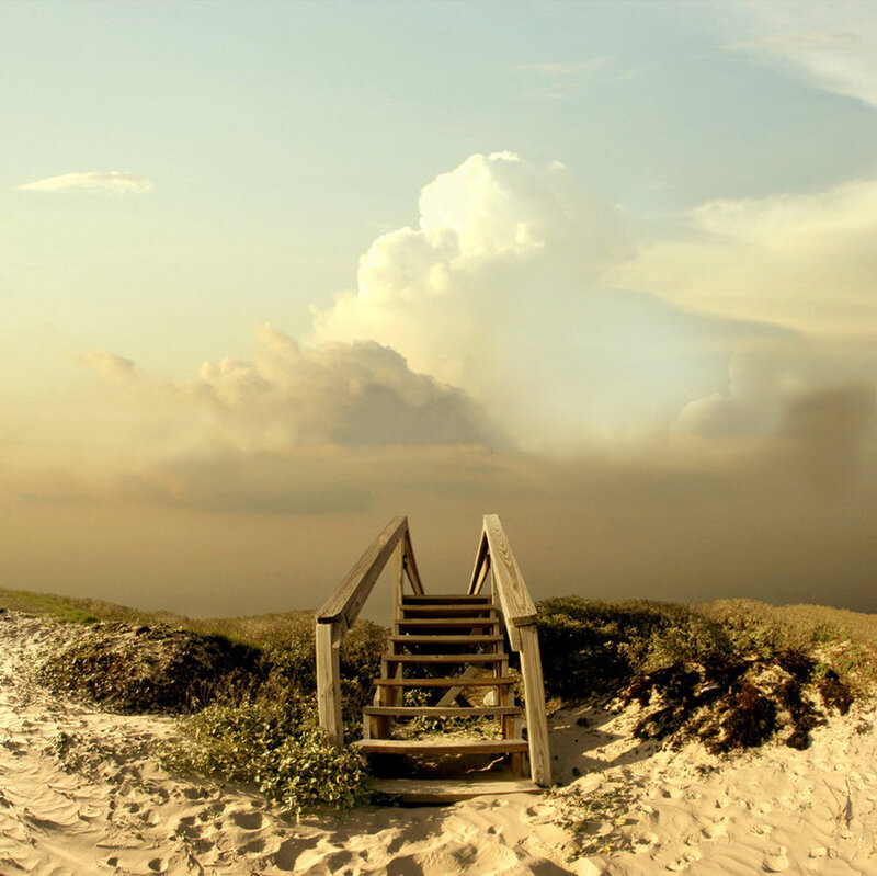 Wooden stairs on a sandy dune